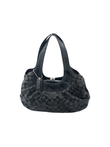 Bolso estilo Hobo marca Coach en Material sintético color Negro. De asas. Artículo de doble uso.