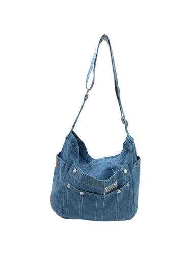 Bolso estilo Hobo en Mezclilla color Azul cielo. De asa. Artículo de doble uso.