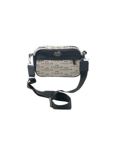 Bolso estilo Crossbody en Vinipiel color Negro con beige. De correa ajustable. Artículo de doble uso.