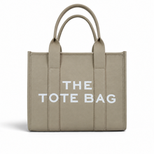 Cargar imagen en el visor de la galería, Bolsa con Leyenda THE TOTE BAG color Beige, Diseño Rectangular y Dos Asas Superiores | Segunda mano