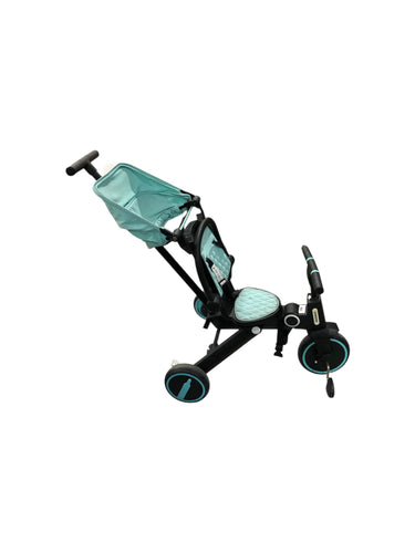 Triciclo De bebe ajustable en color Negro con verde. Artículo de doble uso.